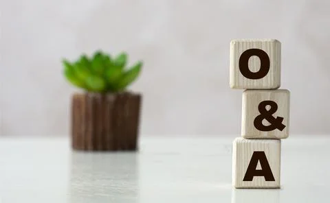 O&A word on wooden cubes on a light background with a cactus Stock Photos