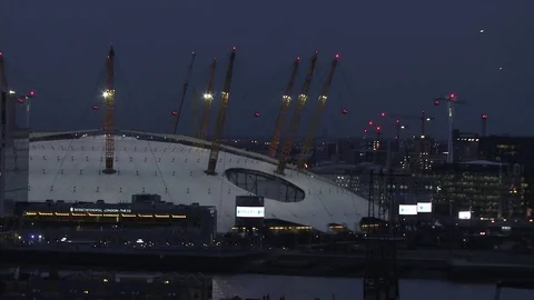 O2 with Emirates air line cable car at night plus barclays sponsorship mid shot Stock Footage 74284514