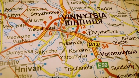 Oad network to vinnytsia, ukraine, gliding macro view over atlas map Stock Footage 341269814