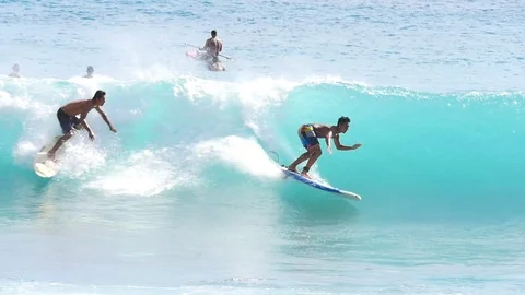OAHU HAWAII - SEPT 5, 2016 Slow Motion people riding boogie board in Sandy Beach Stock Footage 74642333