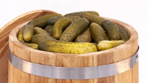 Oak Barrel with Pickled Cucumbers Rotating on a White Background Stock Footage 104258352