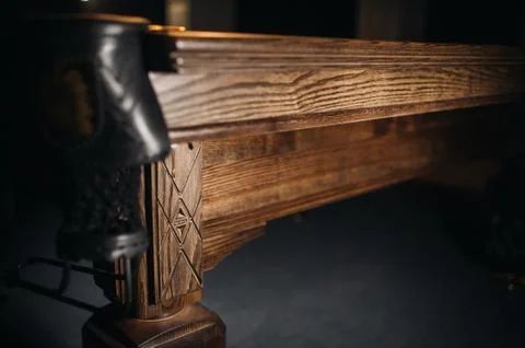 The oak decorative leg of a billiard table looks expensive Foto stock