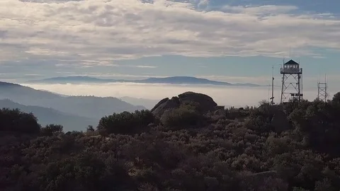Oak Flat FireLookout DJI Mavic Pro Arial Cinematography Heli Flys Parallel Video stock 82748710
