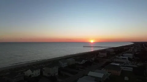 Oak Island beach homes at sunset Stock Footage 328534798
