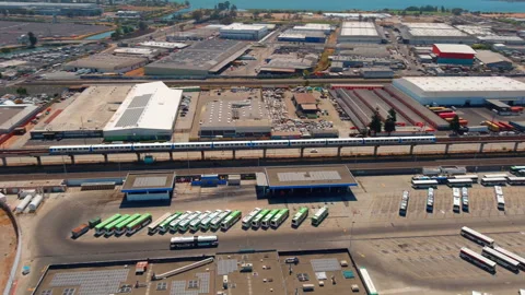 Oakland BART Train Passing Industrial Landscape Stock Footage 267054642