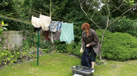 OAP taking in washing Stock Footage 25267216