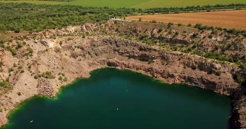Oasis In The Desert Between Green Field And Rocky Terrain. Stock Footage 257669752