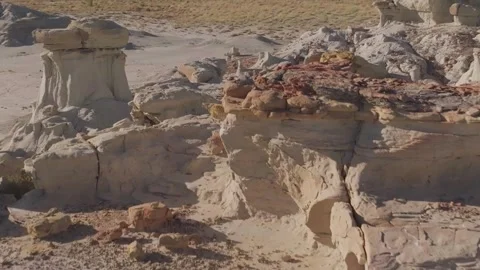 Oasis in desert with orange rocks and yellow sand on sunrise. Stock Footage 296845189