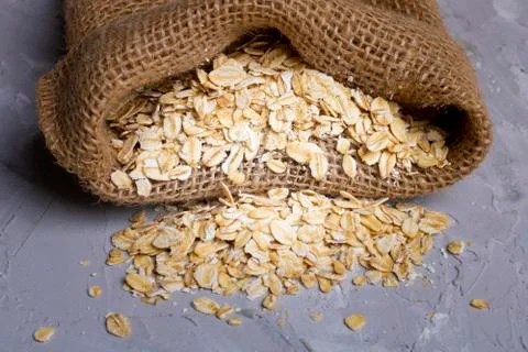 Oat flake in burlap bag, zero waste concept Stock Photos