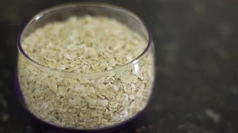 Oat flakes in a bowl Stock Footage 60579499