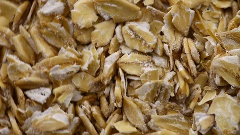 Oat flakes in bulk rotate Stock Footage 129764096