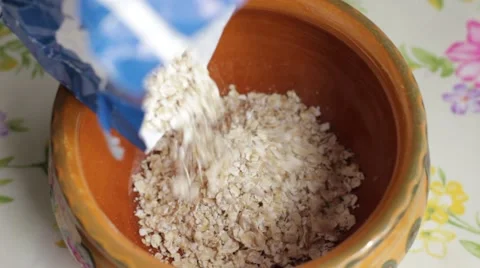 Oat flakes in the ceramic bowl Stock Footage 66753698