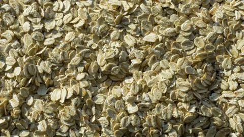 Oat flakes close-up texture background. Stock Photos