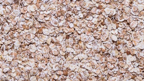 Oat flakes  close up, textured background Stock Footage 124470206