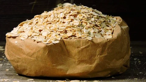 Oat flakes in a paper bag. Stock Footage 102062416