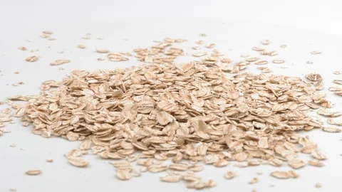 Oat flakes on white background. Grits for Breakfast. Видео 129851313