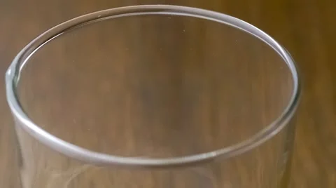 Oat milk drinking beverage forming bubbly bubbles and froth as it pours into  Stock Footage 61531481