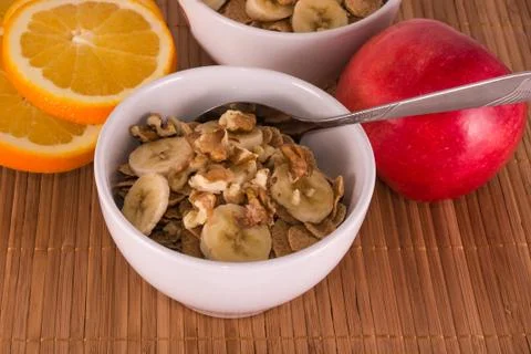 Oatmeal with bananas and walnuts Stock Photos