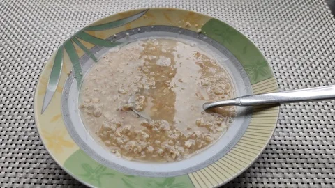 Oatmeal brewed in a plate Stock Footage 128342317