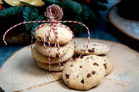 Oatmeal cake with chocolate pieces. A stack of livers tied with a red-white c Stock Photos