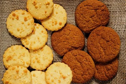 Oatmeal cookie on sackcloth Stock Photos