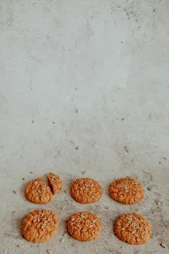 Oatmeal cookies on a gray pattern background Stock Photos