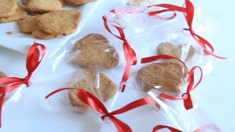 Oatmeal cookies into packages Stock Footage 100077940