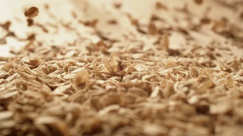 Oatmeal falling on a table. Slow Motion. Stock Footage 128952798