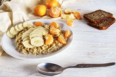 Oatmeal with fruit for breakfast Stock Photos