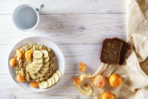 Oatmeal with fruit for breakfast Stock Photos