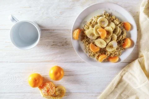 Oatmeal with fruit for breakfast Stock Photos