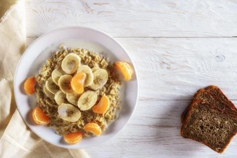 Oatmeal with fruit for breakfast Stock Photos