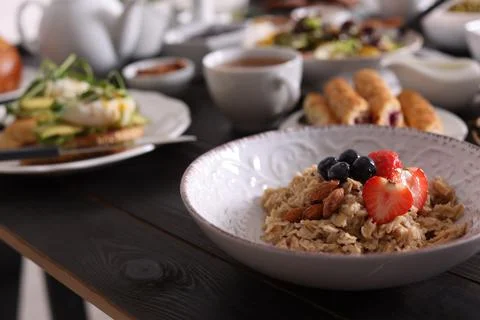 Oatmeal with fruits and nuts served on buffet table for brunch Stock Photos