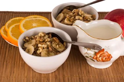 Oatmeal with nuts and bananas Stock Photos