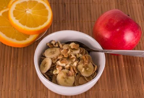 Oatmeal with nuts, banana and apple Stock Photos