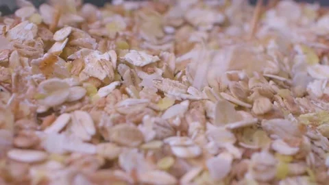 Oatmeal. Oat flakes. Close-up rotating. Dry oat flakes grains background, close 動画素材 151516384