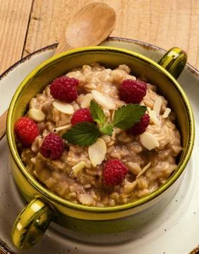 Oatmeal with raspberry Stock Photos
