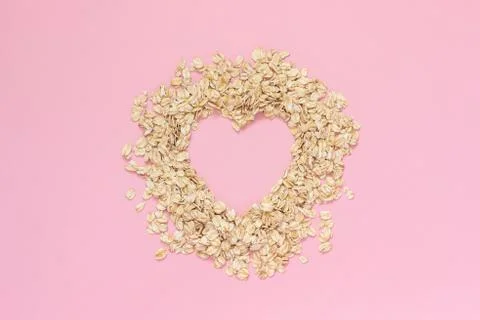 Oatmeal in shape of heart with empty space for text on pink background. Diet  Stock Photos