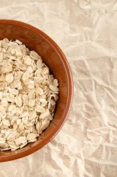 Oatmeal in a small brown bowl Stock Photos