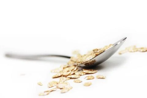 Oatmeal with spoon Stock Photos