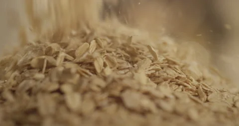 Oatmeal sprinkled on a mirror surface Stock Footage 200257209