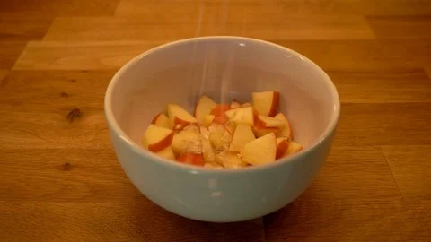 Oats falling into a breakfast bowl - preparing a vegan breakfast with oats, f Stock Footage 120284549