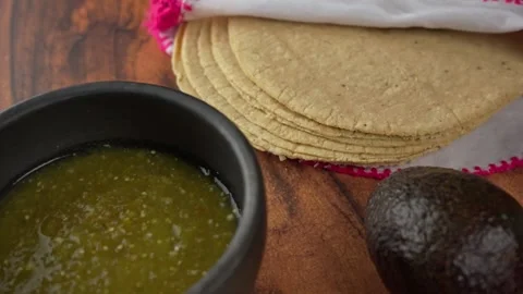 Oaxaca cheese or quesillo with tortillas and sauce, Dolly in Stock Footage 278565149