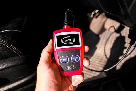 OBD scanner tool , OBD2 scanner in a car mechanic hand Stock Photos