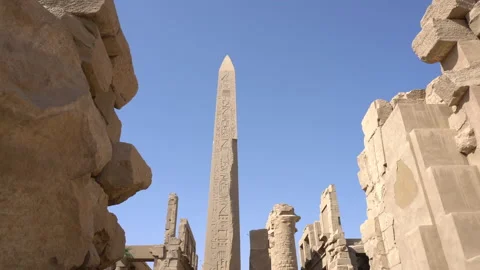 Obelisk between at Great columns Hypostyle Hall Karnak temple Luxor Egypt h.. Vídeos de archivo 232105765