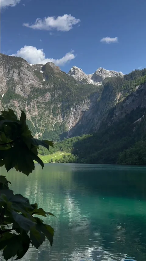 Obersee framed by maple leaves with Roethbachfall waterfall view 動画素材 341768900