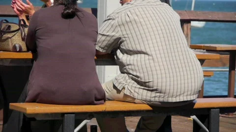 Obese Couple Sitting at Table Stock Footage 722762