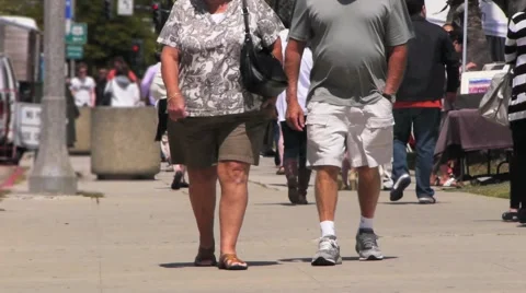 Obese Couple Walking Toward Camera Stock Footage 4430151