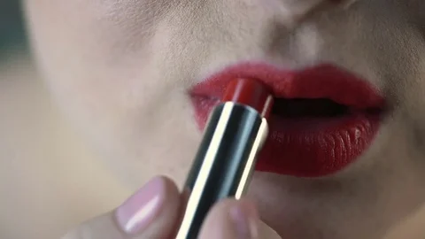 Obese female applying red lipstick and preparing for date with boyfriend Stock Footage