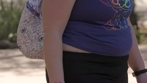 Obese gut walks by Stock Footage 267040156